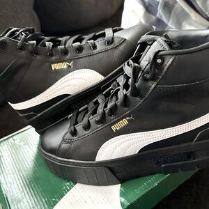 Brand New in box, black and white high top platform pumas.